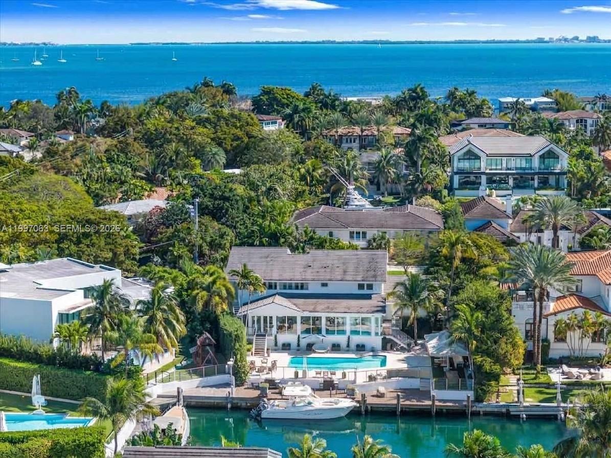 An aerial view of a waterfront home with a swimming pool and a private boat dock — 6832 Sunrise Ct # 0, Coral Gables FL 33133, CORAL GABLES, FL