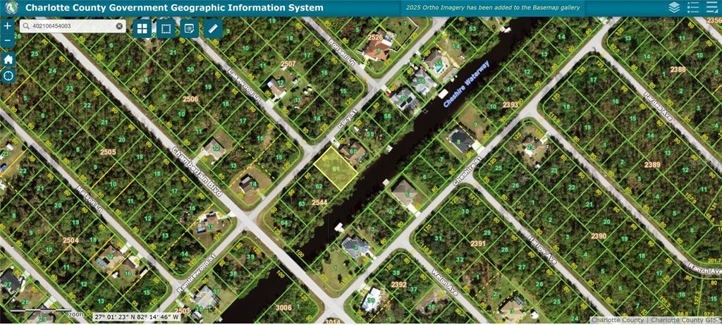 This is a satellite map view showing a residential lot highlighted in yellow near a waterway — 492 CORY STREET, PORT CHARLOTTE, FL