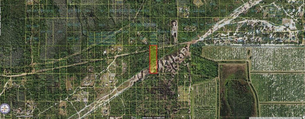 This is an aerial map showing a rectangular parcel of land highlighted in red — HOLOPAW GROVES ROAD, ST CLOUD, FL