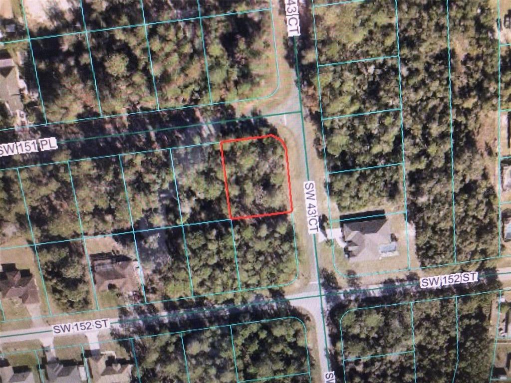 This is an aerial map showing a vacant, wooded residential lot outlined in red — 0 SW 151 PLACE, OCALA, FL