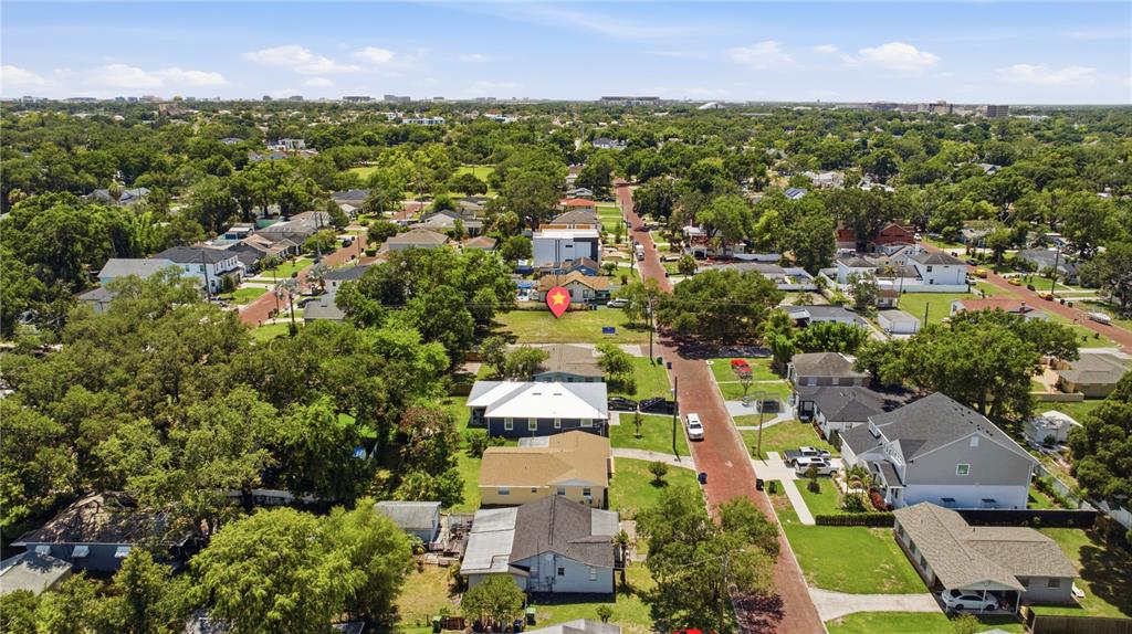An aerial view shows a residential neighborhood with a red location marker on a lot — 904 W FRIBLEY STREET, TAMPA, FL