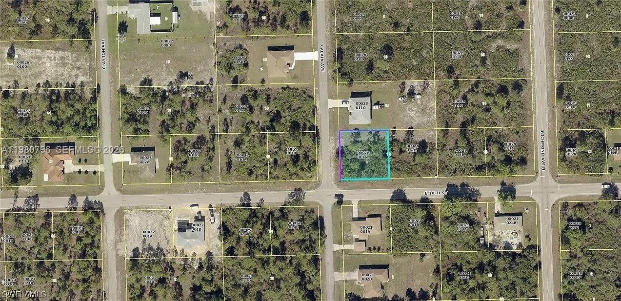 This is an aerial map showing a vacant, rectangular lot highlighted in blue — 301 E 10TH ST 10TH ST, Lehigh Acres FL 33972, LEHIGH ACRES, FL
