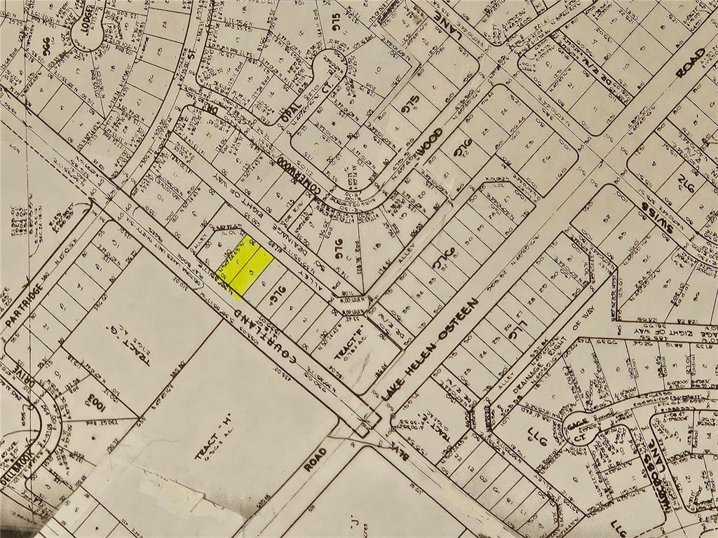 This is a black and white plat map showing property boundaries, street names, and lot numbers — 1407 COURTLAND BOULEVARD, DELTONA, FL