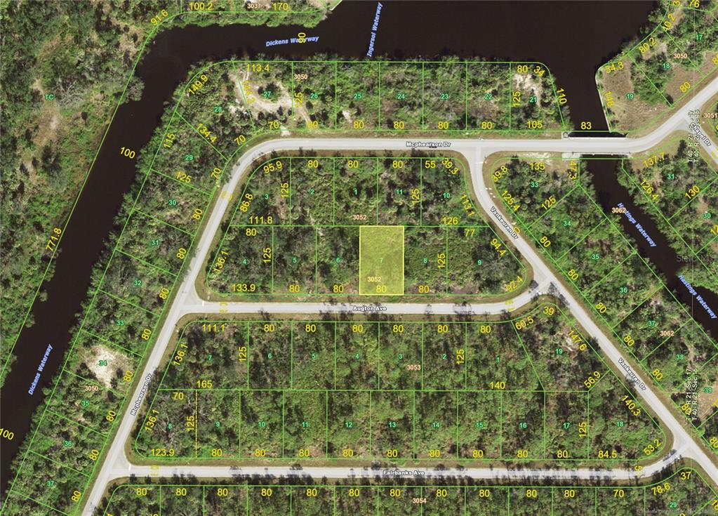 This is a satellite map showing residential lots, streets, and waterways in a neighborhood — 13472 AUGTON (LOT 7) AVENUE, PORT CHARLOTTE, FL