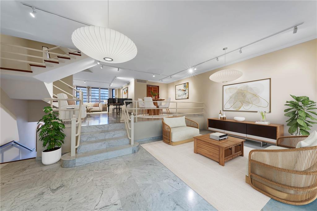 A split-level living area features marble flooring, a staircase, and modern furniture — 552 WAYMOUTH STREET UNIT C, SAN JUAN, PR