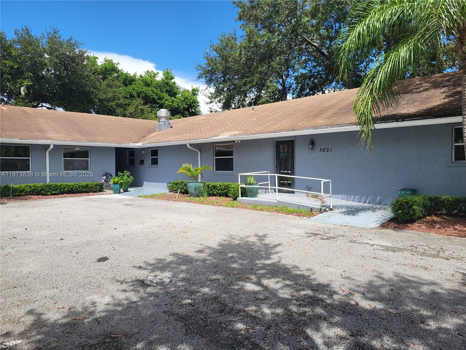 A single-story gray building with a brown shingled roof and a wheelchair access ramp — 3621 NW 90th Ter, Sunrise FL 33351, SUNRISE, FL