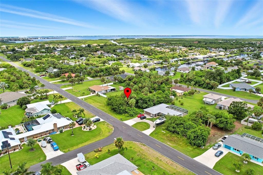 An aerial view shows a residential neighborhood with a red location pin on a lot — 18645 LAKE WORTH BOULEVARD, PORT CHARLOTTE, FL