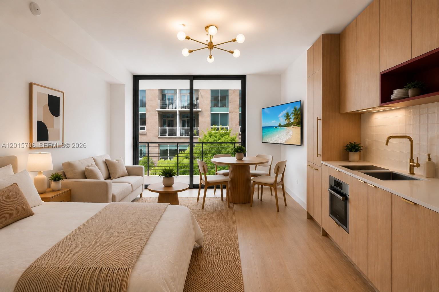 This studio apartment features a kitchenette, a dining area, and a bed near a balcony — 90 NE 32nd # 313, Miami FL 33137, MIAMI, FL