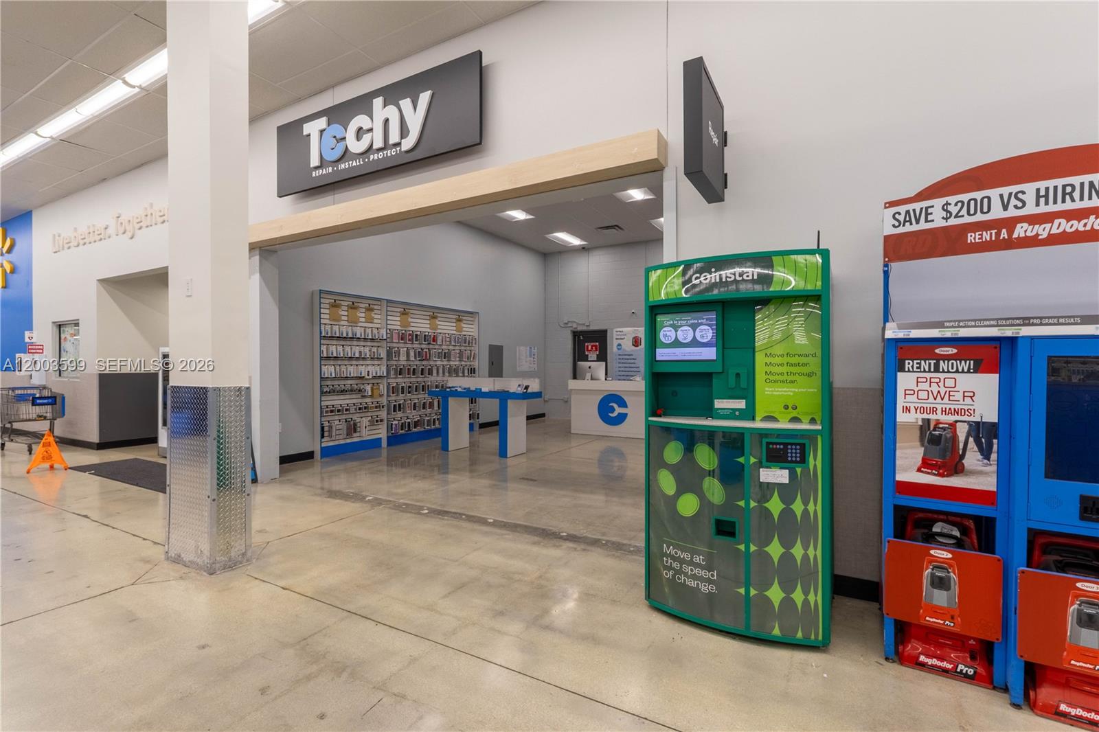 A retail space entrance features a Techy repair shop, a Coinstar kiosk, and RugDoctor rentals — 1800 S University Dr, Miramar FL 33025, MIRAMAR, FL