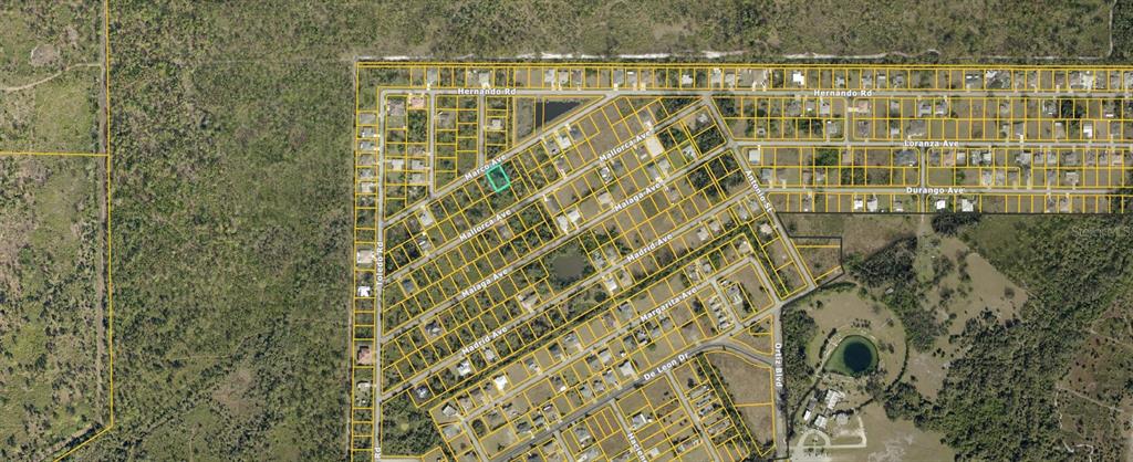 This is an aerial map showing a residential lot highlighted in a subdivision — LOTS 27 & 28 MARCO AVENUE, NORTH PORT, FL