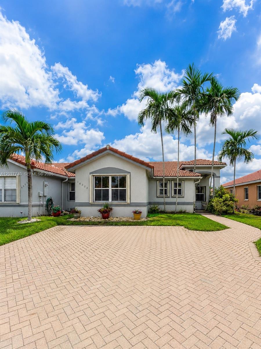 A single-story house with a tiled roof, stucco exterior, and a paved driveway — 16355 SW 46th Ter # 16355, Miami FL 33185, MIAMI, FL