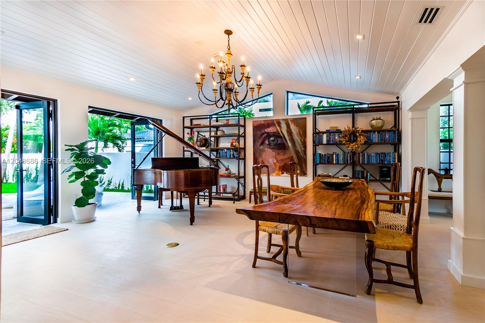 A dining room features a live-edge wood table, a grand piano, and built-in shelving — 255 PALM AVENUE, Miami Beach FL 33139, MIAMI BEACH, FL