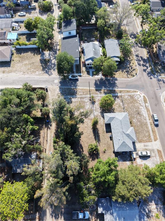 An aerial view shows a residential neighborhood with houses, trees, and paved streets — 14TH AVENUE S, ST PETERSBURG, FL