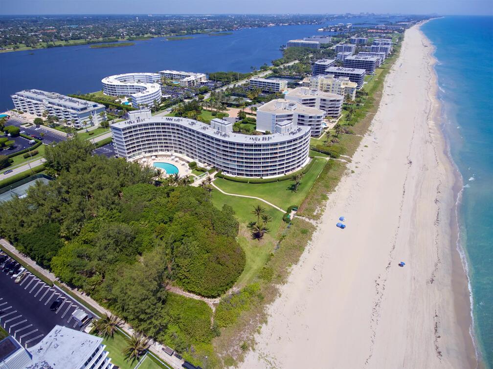 Aerial view of beachfront condominium buildings situated between the ocean and an inland waterway — 2774 S Ocean Boulevard # 708, Palm Beach FL 33480, PALM BEACH, FL