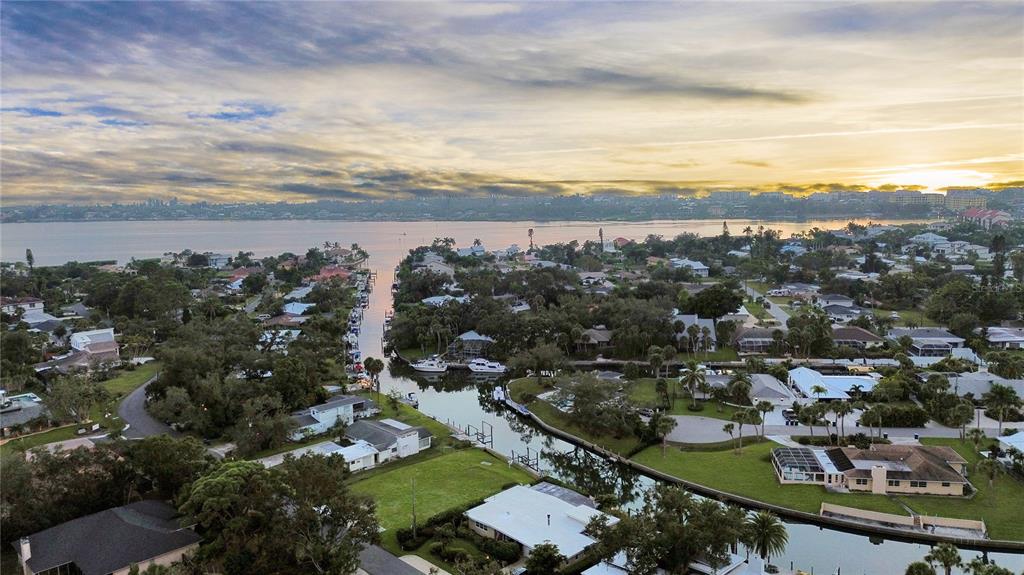 An aerial view of a waterfront residential neighborhood with canals leading into a large bay — 1849 BAYWOOD DRIVE, SARASOTA, FL