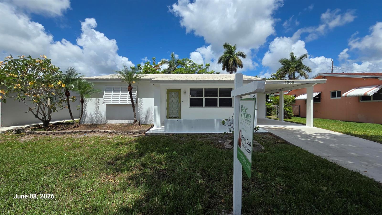 A white single-story house with a carport and a real estate sign in the yard — 2000 N 31st Avenue, Hollywood FL 33021, HOLLYWOOD, FL