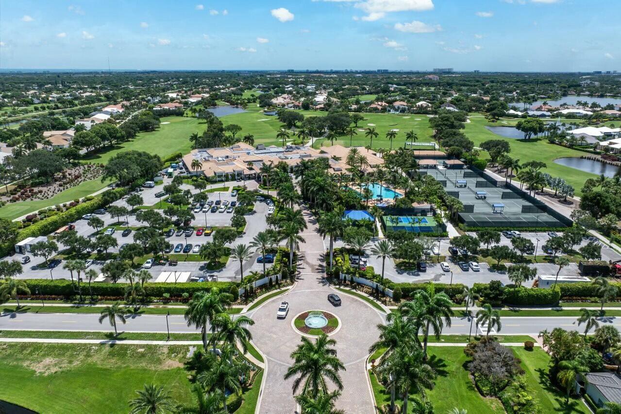 An aerial view of a clubhouse with a parking lot, tennis courts, and a golf course — 4356 Kasso Circle, Boca Raton FL 33487, BOCA RATON, FL