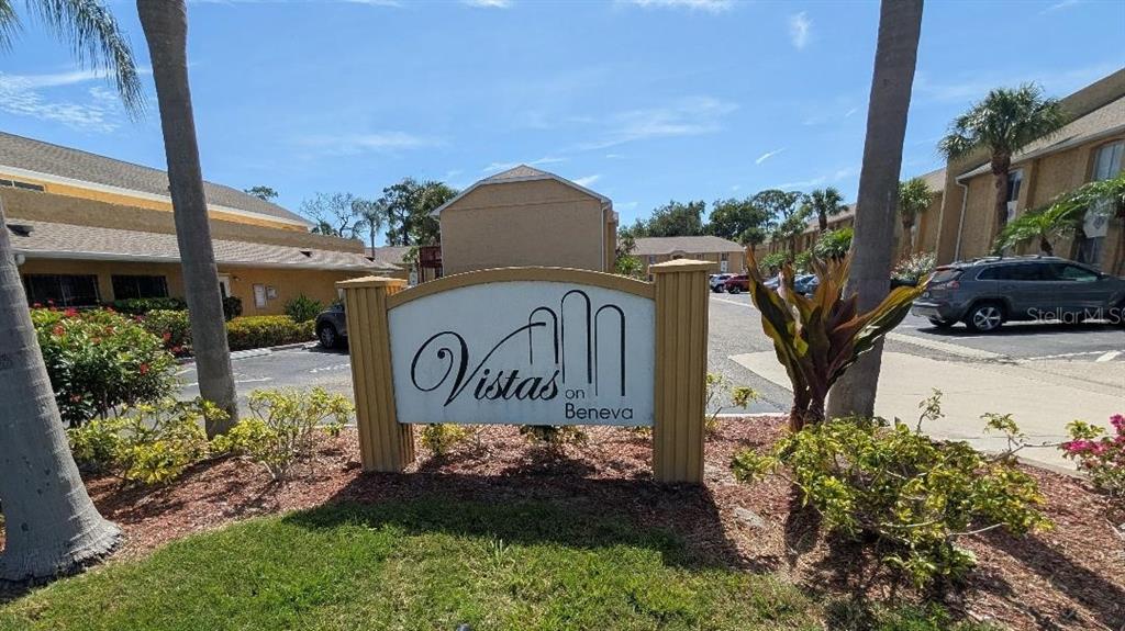 A sign for Vistas on Beneva stands in front of a multi-story apartment complex — 1841 PARAKEET WAY UNIT 1101, SARASOTA, FL