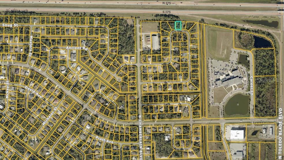 This is an aerial map showing a residential neighborhood with a highlighted vacant lot — LARAMIE CIRCLE, NORTH PORT, FL