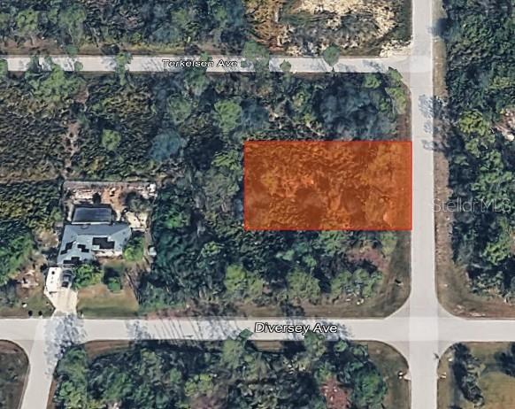 An aerial view shows a rectangular vacant lot highlighted in orange at a street intersection — 4397 KENNEL STREET, PORT CHARLOTTE, FL