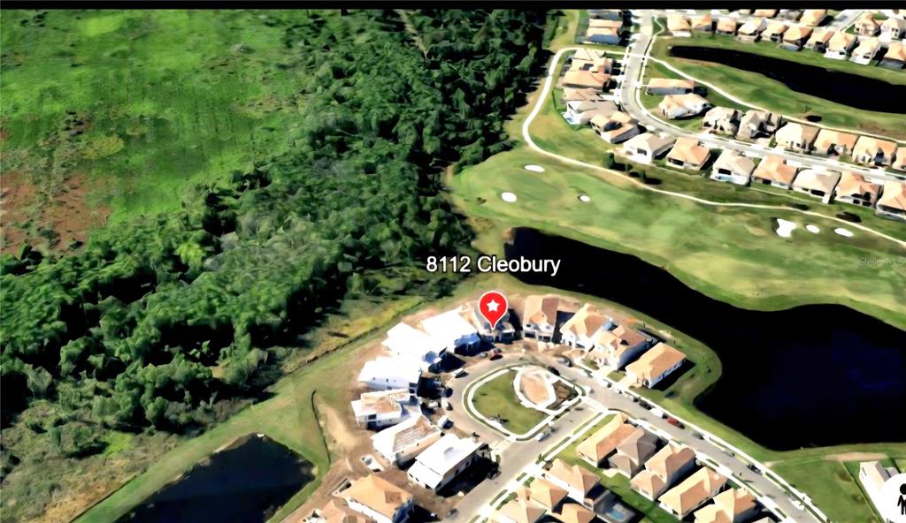 An aerial view of a two-story house with a backyard pool and patio area — 8112 CLEOBURY DRIVE, ORLANDO, FL