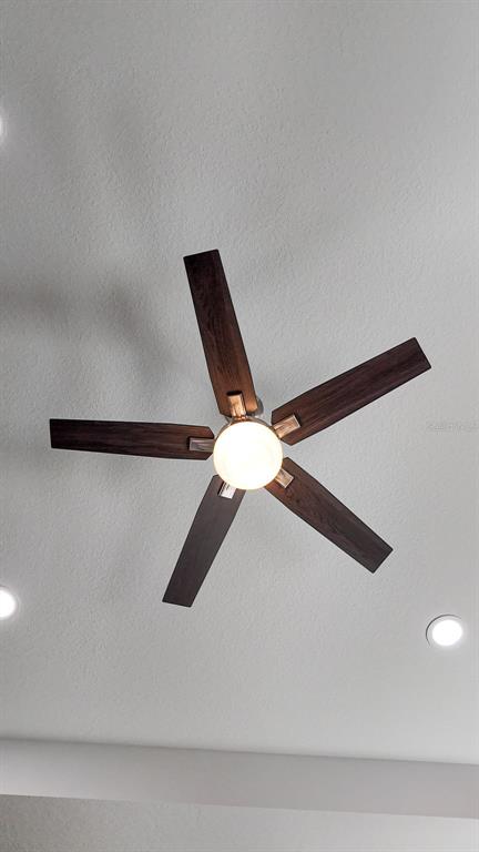 A five-blade ceiling fan with a central light fixture is mounted on a white ceiling — 9100 DORIE DRIVE, TRENTON, FL