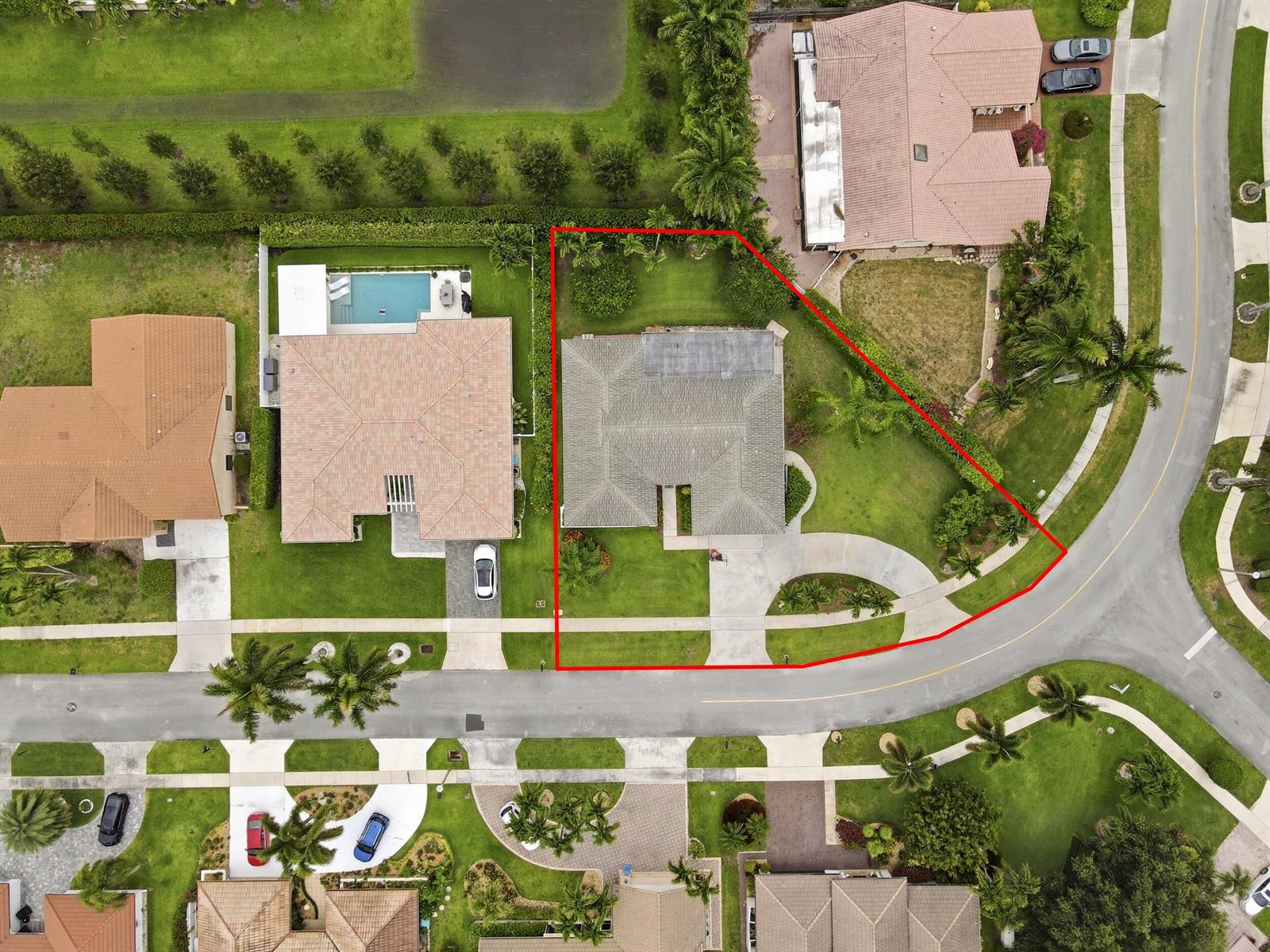 An aerial view shows a single-family home with a large yard on a corner lot — 2657 SW 23rd Cranbrook Drive, Boynton Beach FL 33436, BOYNTON BEACH, FL