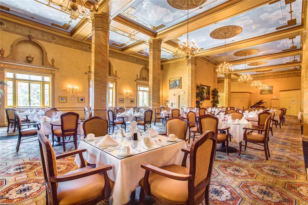 A formal dining room features tables with white tablecloths, ornate columns, and a painted ceiling — 411 1ST AVENUE N UNIT 307, ST PETERSBURG, FL