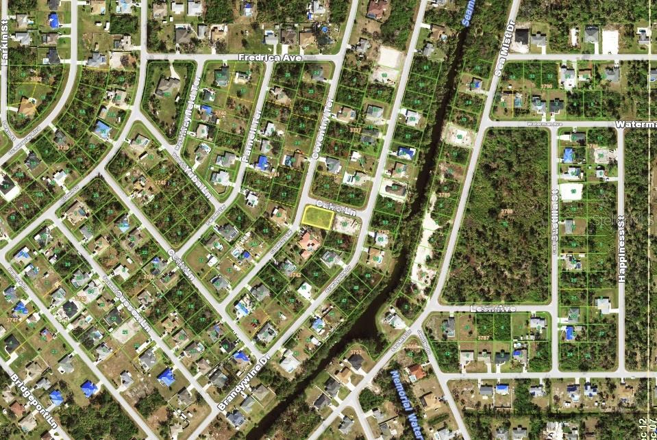 This is an aerial map showing a vacant residential lot highlighted in yellow — 7140 COVENTRY TERRACE, ENGLEWOOD, FL