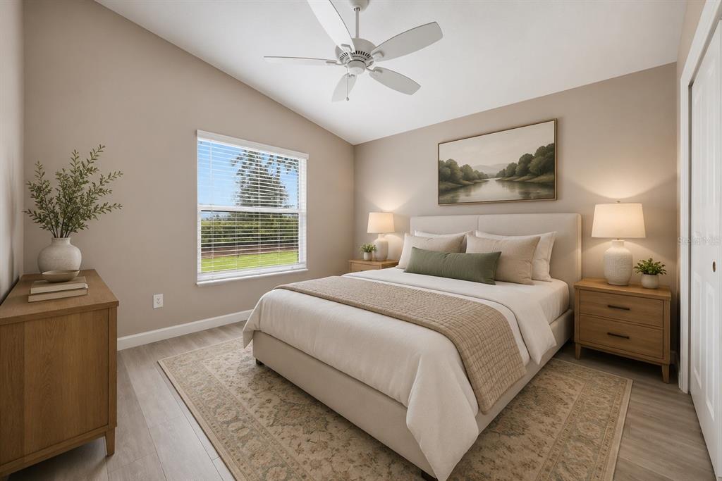 A bedroom features a queen bed, two nightstands, a dresser, and a ceiling fan — 302 ZINGALE LANE, THE VILLAGES, FL