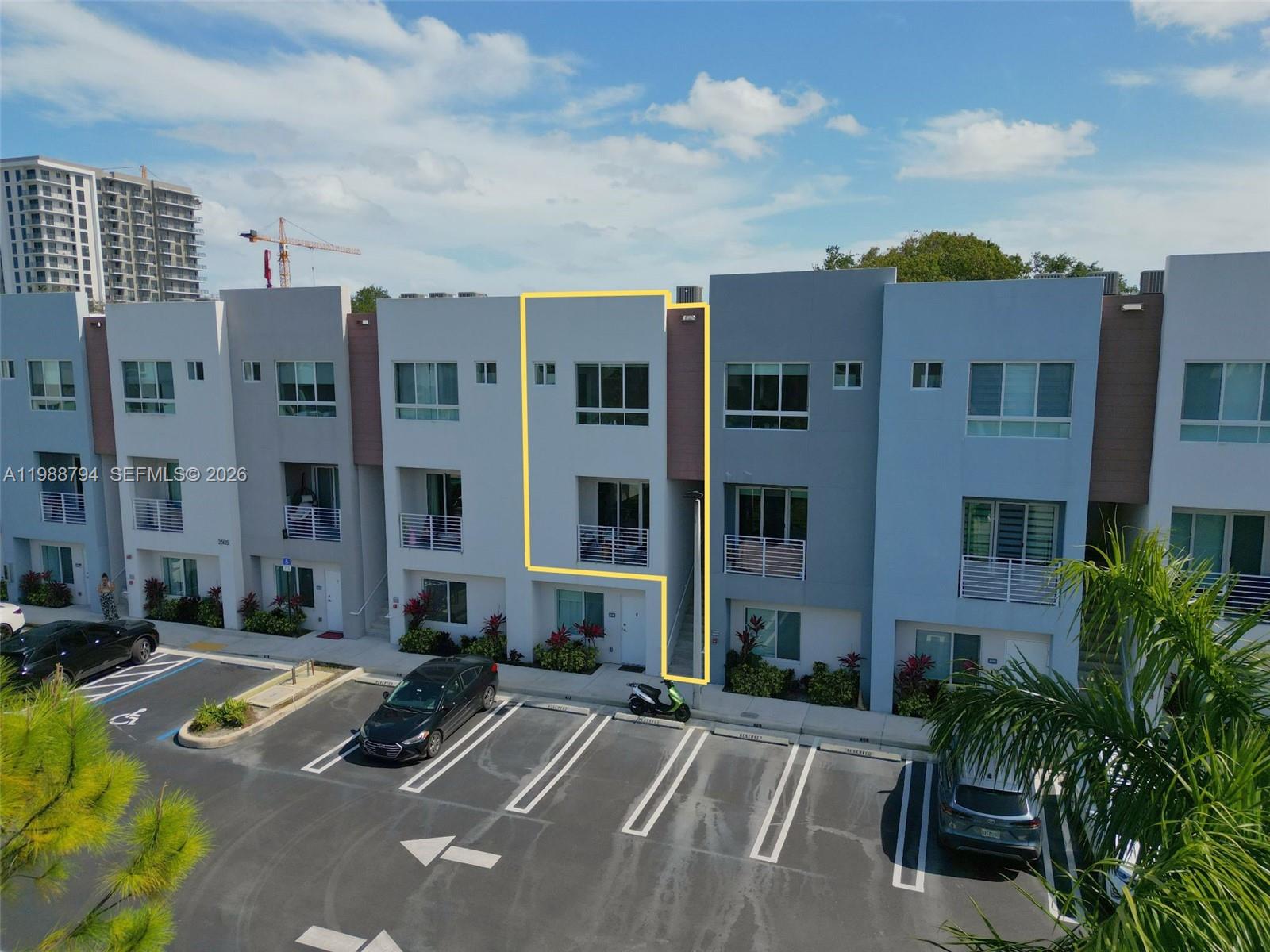 An exterior view of a multi-story townhouse complex with a highlighted unit — 2505 NE 193rd St # 4208, Miami FL 33180, MIAMI, FL
