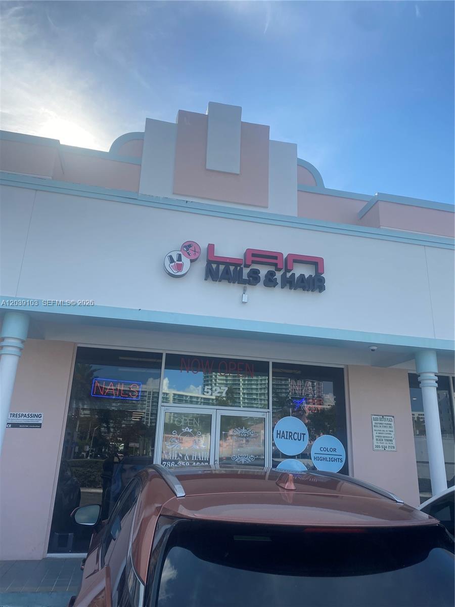 The exterior of a commercial storefront features a sign for a nail and hair salon — 1527 Alton Rd, Miami Beach FL 33139, MIAMI BEACH, FL