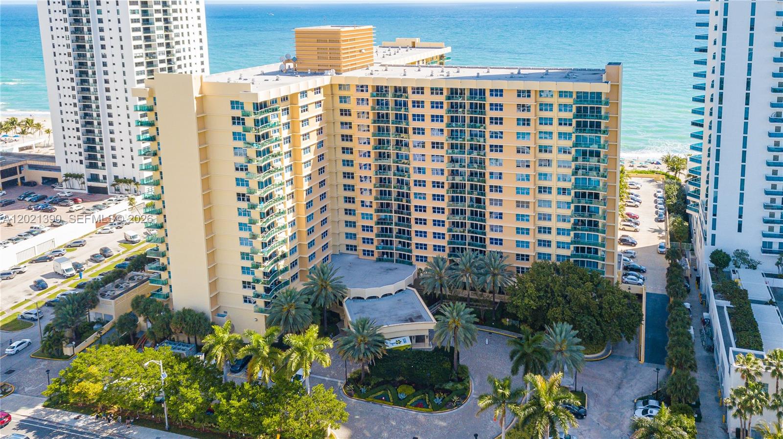 An aerial view of a multi-story tan residential building with balconies near the ocean — 2501 S Ocean Dr # 1603, Hollywood FL 33019, HOLLYWOOD, FL
