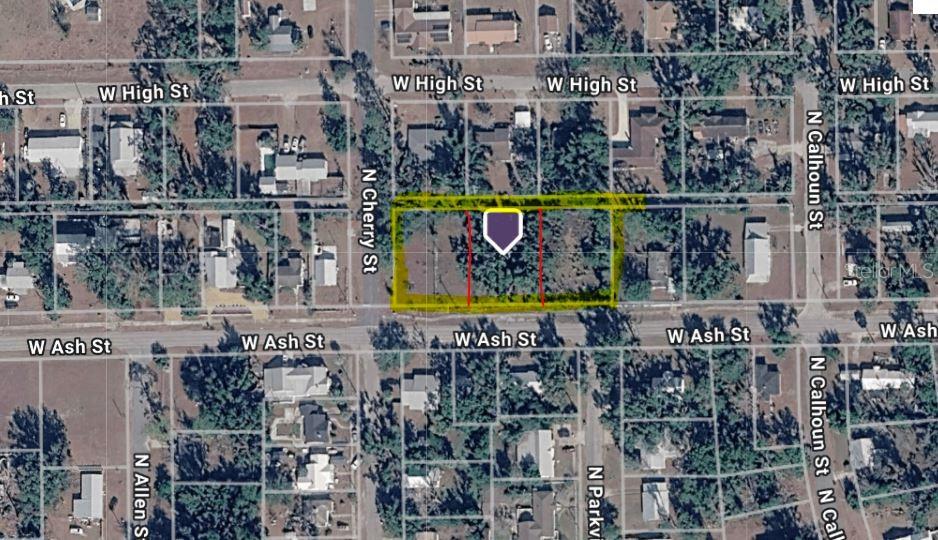 This is an aerial map showing a vacant rectangular lot highlighted in yellow on a street — 400 W ASH STREET, PERRY, FL