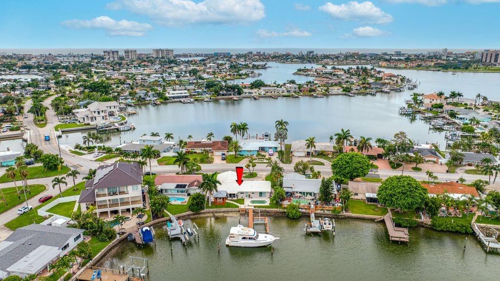An aerial view of a waterfront house with a private dock and boat on a canal — 530 79TH STREET S, ST PETERSBURG, FL