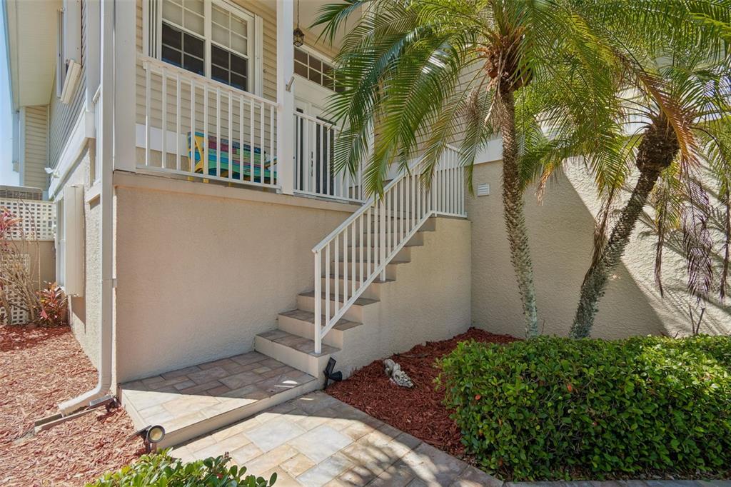 A view of a canal with a moored catamaran and a central mangrove island — 6211 BAYSIDE DRIVE, NEW PORT RICHEY, FL