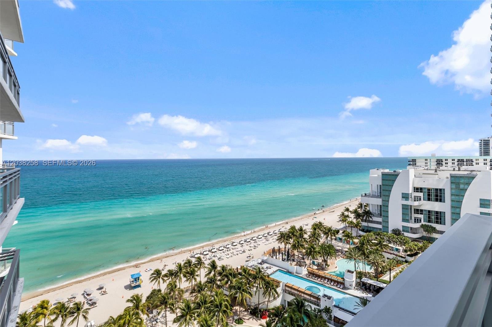 A high-angle view shows a sandy beach, turquoise ocean, and a resort pool area — 3535 S Ocean Dr # 1703, Hollywood FL 33019, HOLLYWOOD, FL