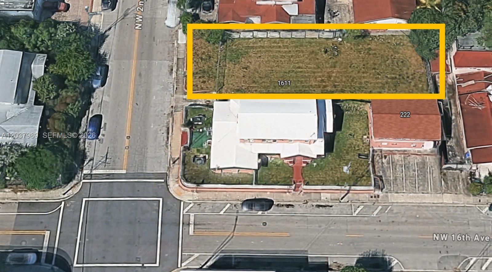 An aerial view shows a rectangular vacant lot outlined in yellow next to a building — 1611 NW 2nd St, Miami FL 33125, MIAMI, FL