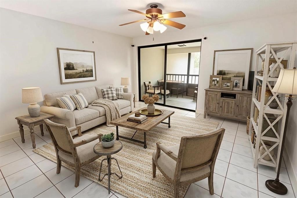 A living room with a beige sofa, two armchairs, a coffee table, and a ceiling fan — 2700 NEBRASKA AVENUE UNIT 2-205, PALM HARBOR, FL