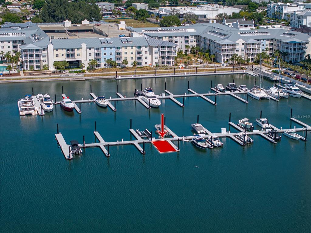 An aerial view shows a marina with multiple boat slips and a highlighted dock space — 5120 MARINA WAY UNIT D-W-15, TAMPA, FL