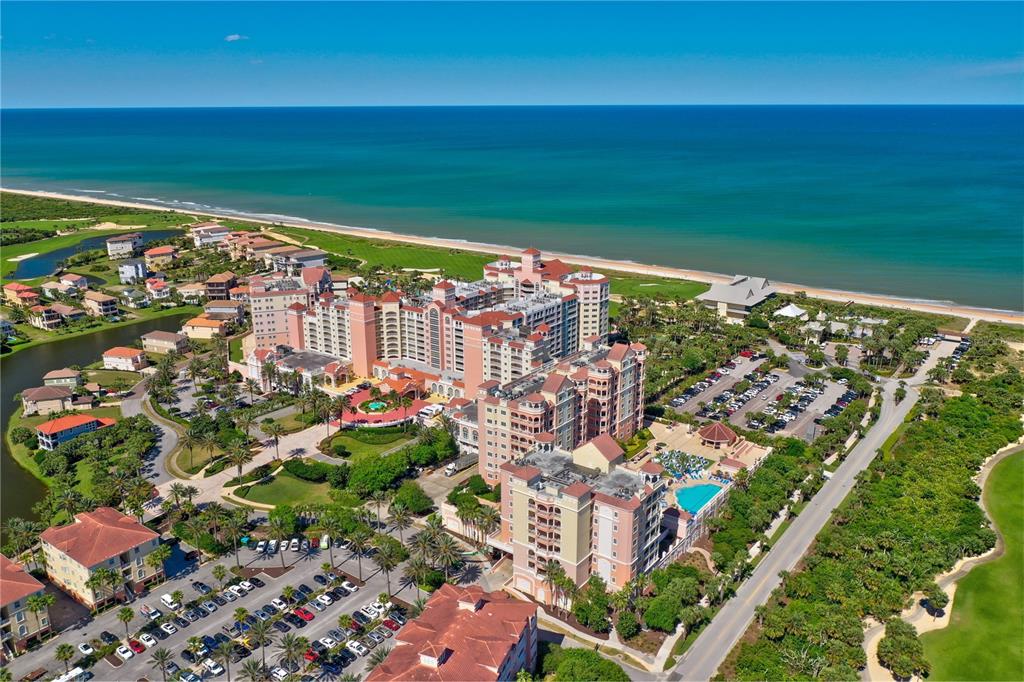 An aerial view of a large resort hotel complex situated along a sandy beach — 200 OCEAN CREST DRIVE UNIT 622, PALM COAST, FL