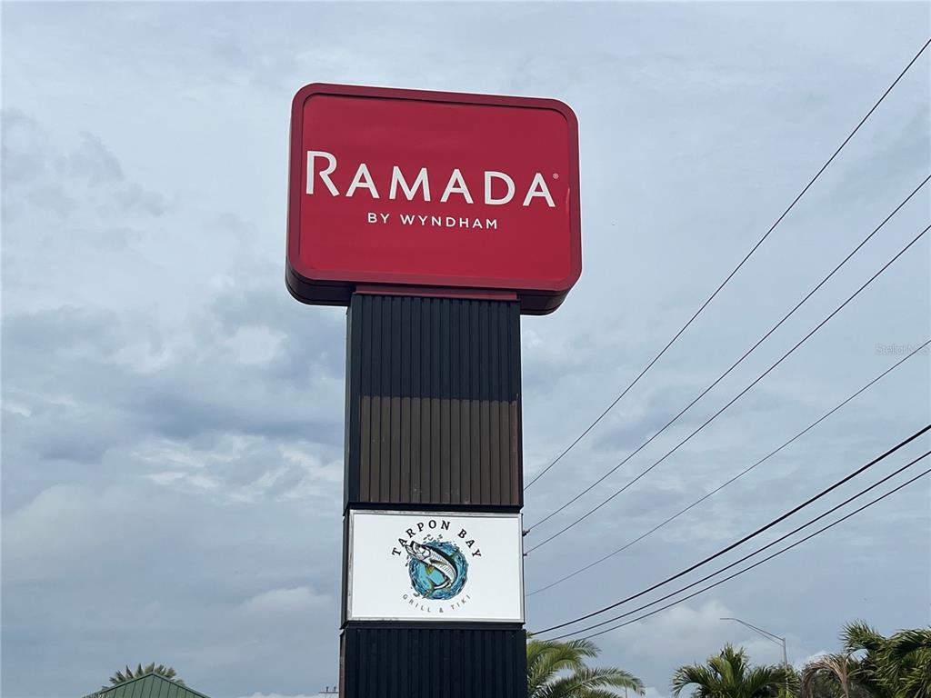 A tall sign displays the Ramada by Wyndham logo above a Tarpon Bay Grill sign — 7150 N TAMIAMI TRAIL UNIT S512, SARASOTA, FL