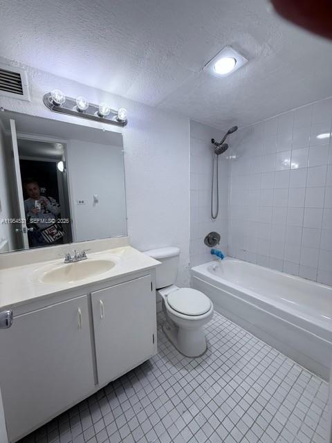A bathroom features a white vanity, a toilet, and a tiled shower-tub combination — 4550 NW 9th St # 812E, Miami FL 33126, MIAMI, FL