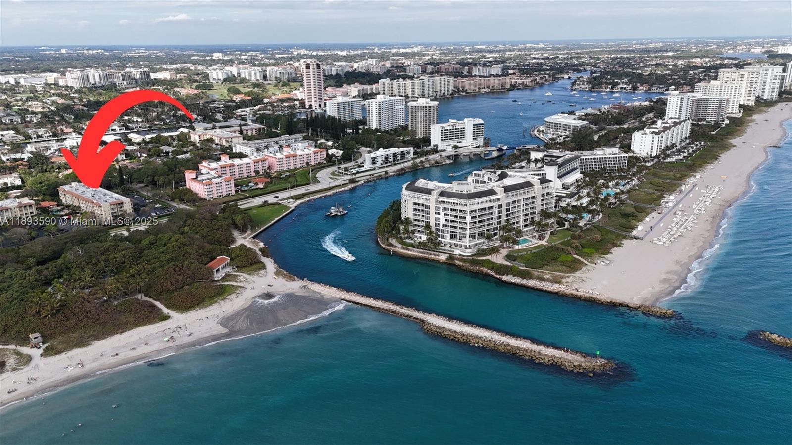An aerial view shows a coastal inlet with a red arrow pointing to a residential building — 950 Ponce De Leon Rd # 2100, Boca Raton FL 33432, BOCA RATON, FL