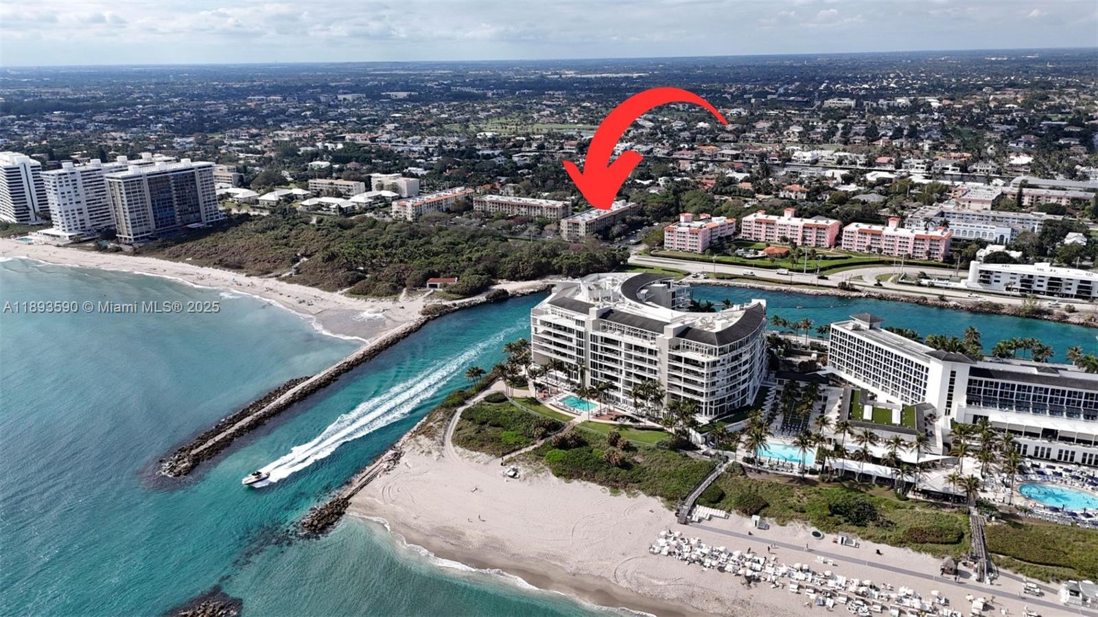 An aerial view shows a coastal resort with a large inlet and surrounding residential buildings — 950 Ponce De Leon Rd # 2100, Boca Raton FL 33432, BOCA RATON, FL