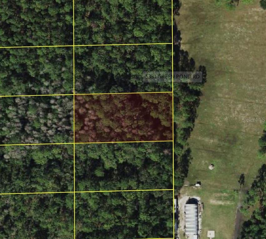 An aerial map view shows a rectangular plot of land highlighted among wooded areas — POLK CITY, POLK CITY, FL