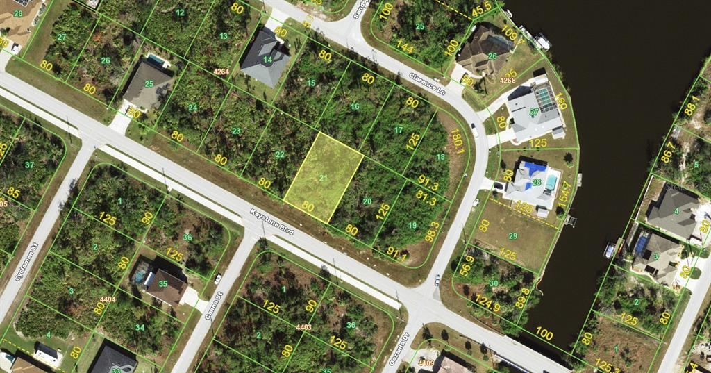 This is an aerial map showing a vacant lot highlighted in yellow within a residential neighborhood — 13372 KEYSTONE BOULEVARD, PORT CHARLOTTE, FL
