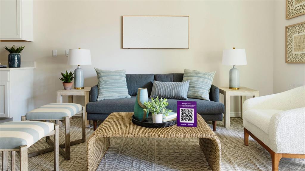 A living room features a gray sofa, a woven coffee table, and two side tables — 4096 GOLD DUST LANE, SARASOTA, FL