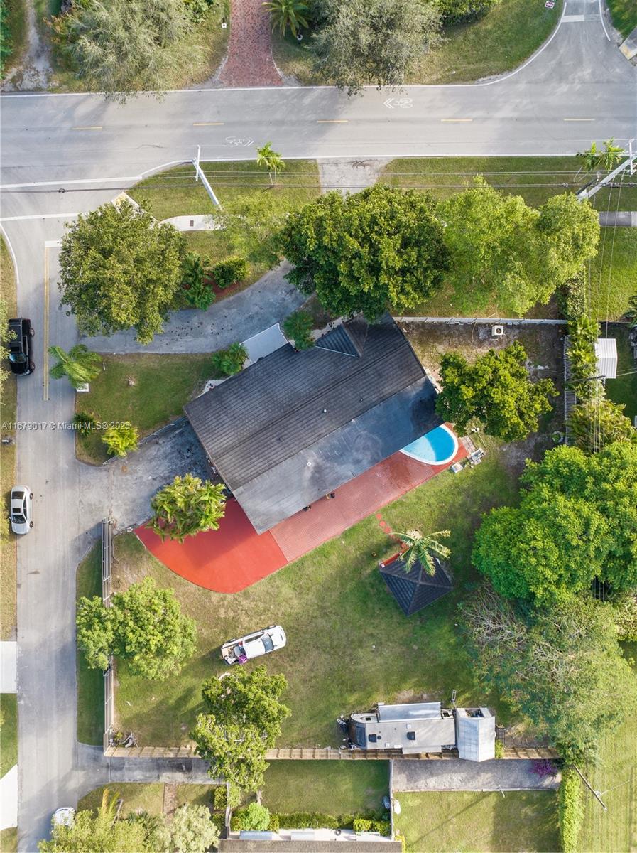 An aerial view shows a house with a pool, red patio, and large yard — 13550 SW 99th Pl, Miami FL 33176, MIAMI, FL