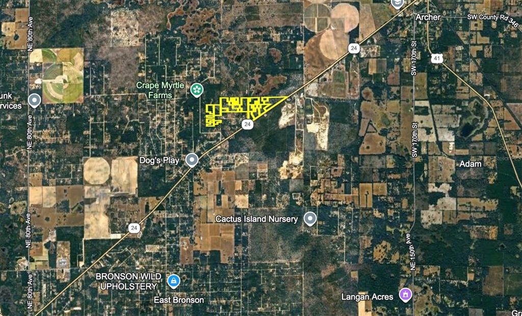 This is an aerial map showing a highlighted property parcel along State Road 24 — 120 NE SR24 AVENUE NE, ARCHER, FL